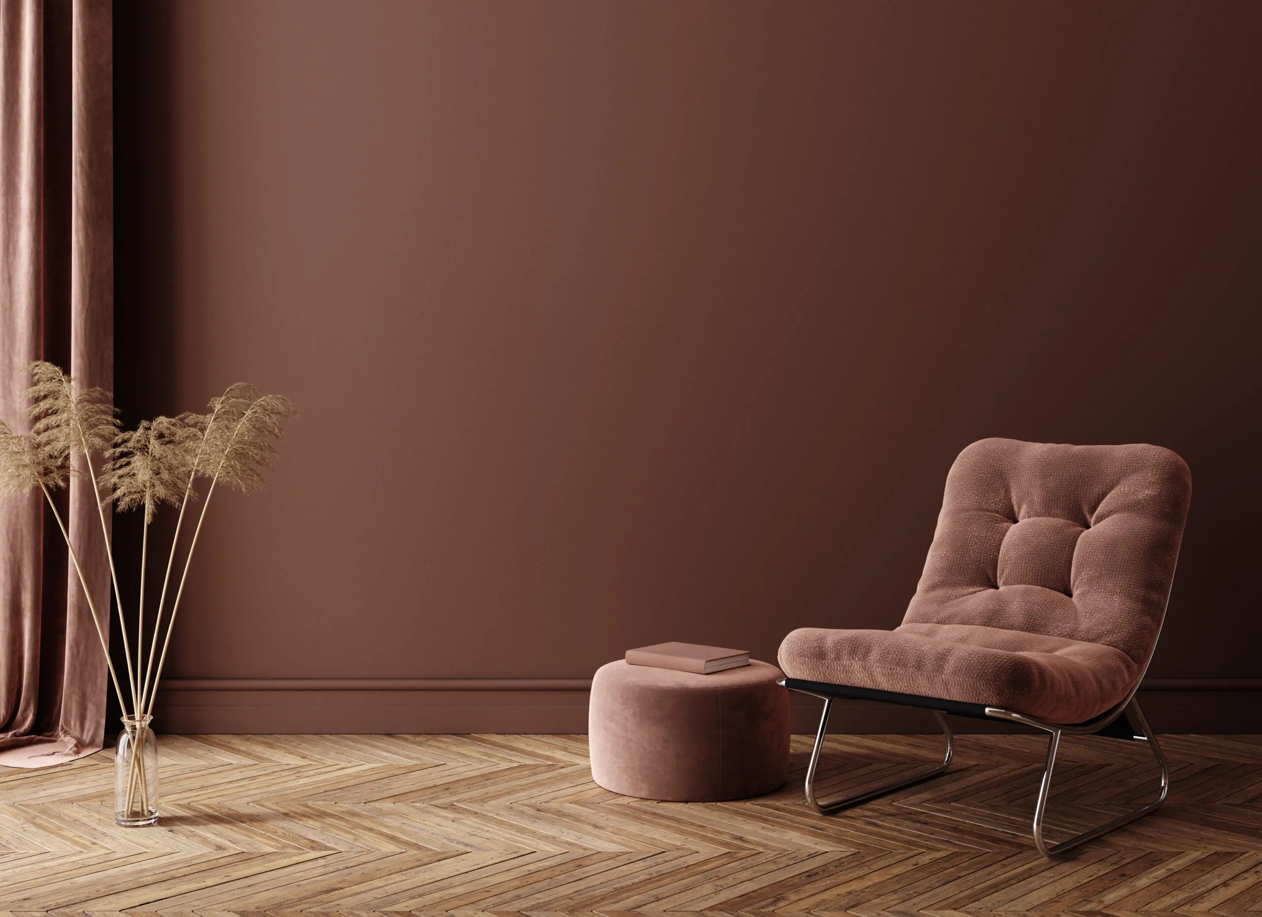 Minimalist interior design featuring a plush tufted chair, round ottoman, and dried pampas grass, showcasing expat housing services in the Netherlands for stylish and cozy living